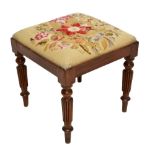 A 19th century mahogany framed stool with tapestry top, raised on fluted column supports, height