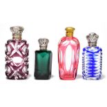 Four Victorian cut coloured glass scent bottles, comprising a purple coloured scent bottle and