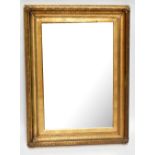 A gilt wood and gesso picture frame mirror, the 19th century frame with a modern bevelled mirror