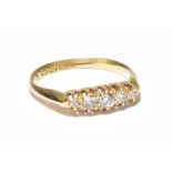 An 18ct gold five stone diamond ring, size approx N, gross weight approx 2.5g.