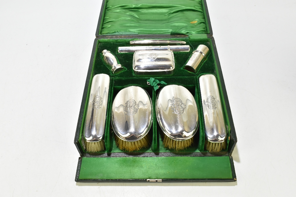 ROBERT CHANDLER; a cased George V hallmarked silver nine piece gentleman's vanity set, comprising - Image 2 of 12