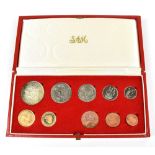 A South African 1973 ten coin set comprising gold two and one rand coins, approx 12.0g, a silver one