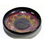 ROYAL DOULTON; an unusual flambé bowl of circular form with floral detail to the centre, diameter