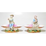 A pair of 19th century Meissen figural sweetmeat dishes modelled as a male and female companion