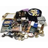 An extensive collection of costume jewellery including brooches, necklaces, etc.