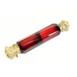 A Victorian gilt white metal mounted ruby glass double ended scent bottle, with hinged cover and