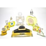 A group of perfume factice shop display bottles including Gres Cabochard with ribbon, height 23cm,