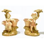 HADLEY ROYAL WORCESTER; a pair of hand painted blush ivory figural vases, modelled as a farmer boy