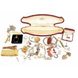 A small collection of assorted costume jewellery to include a plated locket, various brooches, etc.