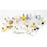 SCENT BOTTLES; fifty glass scent bottles and atomisers of different sizes and colours, mainly blue