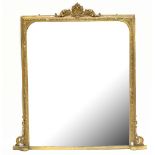 A 19th century giltwood and gesso overmantel mirror, with shell and foliate crest above a shaped