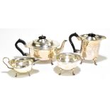 W J MYATT & CO; a George V hallmarked silver four piece tea set, all with shaped rims raised on four
