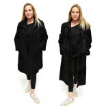 A vintage Astrakhan black curly lamb 3/4 length fur coat made by Mertons, the Furriers,