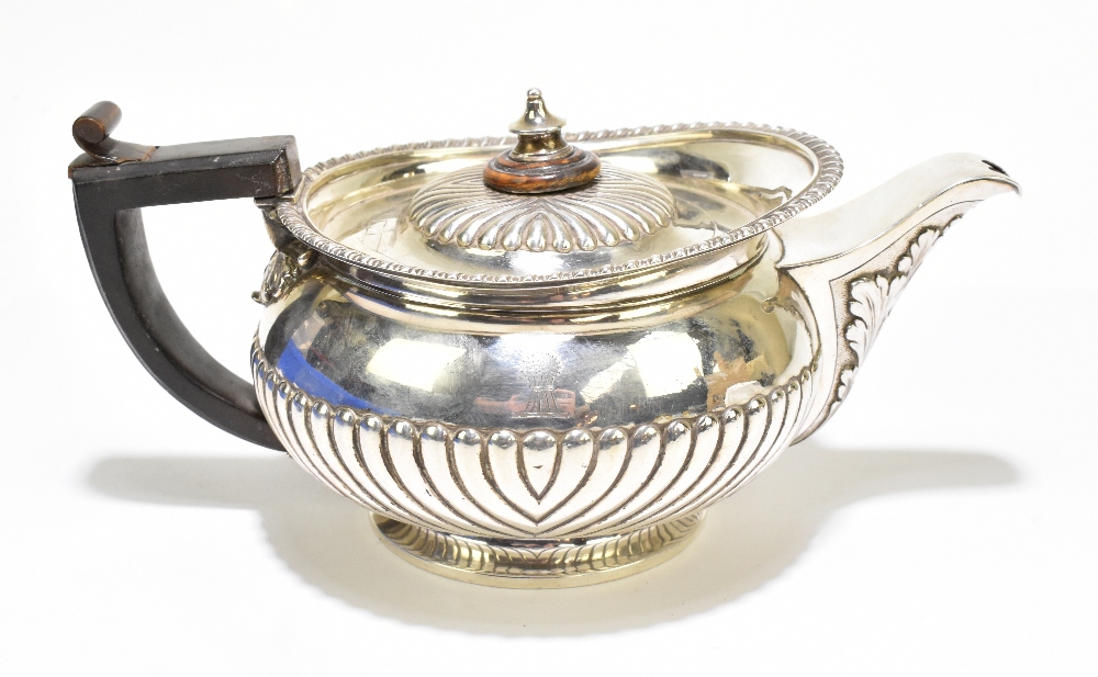 JOHN HAWKINS; a George III silver teapot, with gadrooned rim, acanthus leaf moulded spout and demi-