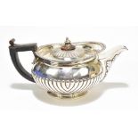 JOHN HAWKINS; a George III silver teapot, with gadrooned rim, acanthus leaf moulded spout and demi-