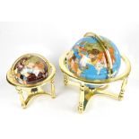 Two modern table globes, each inset with semi-precious stones, height of largest example 47cm (2).