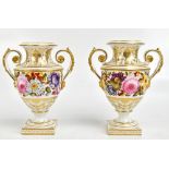 DERBY; a pair of 19th century handpainted twin handled pedestal vases, decorated with roses and