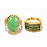 A Chinese yellow metal and polished oval jade cabochon four claw set ring size L and a further