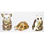 ROYAL CROWN DERBY; three limited edition paperweights comprising 'Imperial Panda', 922/1000, with