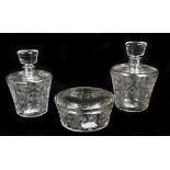 BACCARAT; a three-piece etched glass dressing table set comprising two large scent bottles, 14cm and