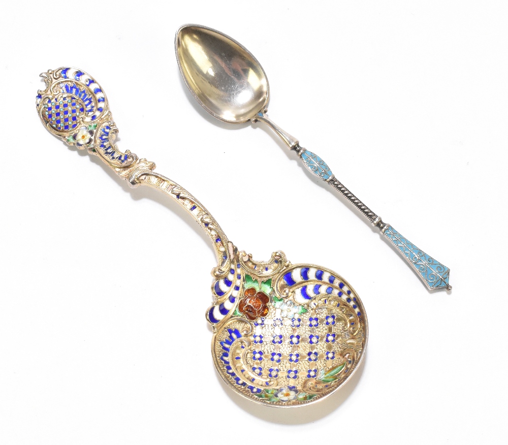 A Russian sterling silver and enamelled teaspoon, the teardrop shaped bowl with blue and white