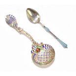 A Russian sterling silver and enamelled teaspoon, the teardrop shaped bowl with blue and white