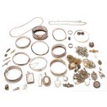 A large collection of silver jewellery including ten hinged and fixed bangles, Scottish brooch,