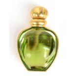 CHRISTIAN DIOR; a gold tone vintage brooch shaped as a perfume bottle made from a green lucit