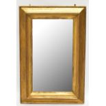 A 19th century giltwood and gesso framed rectangular wall mirror, formerly a picture frame, height