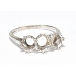 An 18ct white gold ring setting for a three stone ring size O, approx 3.1g.Additional InformationThe