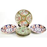 A Cantonese Famille Rose plate, diameter 24cm, with three Korean celadon ground plates, diameter