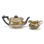 A & J ZIMMERMAN; a Victorian hallmarked silver teapot with ebonised handle and gadrooned detail,