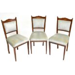 A set of six Edwardian inlaid mahogany dining chairs, with blue upholstered backs and seats, on