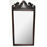 A mahogany framed mirror with carved pediment, approx 107cm x 52cm.Additional InformationScuffs,