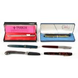 A collection of assorted fountain and ballpoint pens to include Parker example with 14ct nib, a