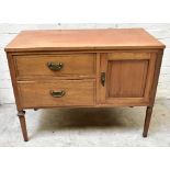 An Edwardian mahogany side cupboard, with two drawers flanked on one side by a single cupboard door,