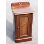 A Victorian mahogany pot cupboard, with panelled door on plinth base, height 81cm, width 41.5cm,