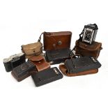A group of vintage cameras including numerous Kodak examples, the majority cased.Additional