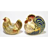 ROYAL CROWN DERBY; two limited edition paperweights comprising 'Farmyard Cockerel', 2629/5000,