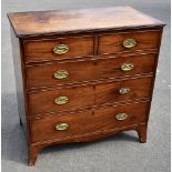 A Georgian mahogany chest of two short over three long drawers, raised on bracket feet, width