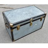 A mid-20th century cabin trunk of rectangular form, with studded detail to the edges and top,