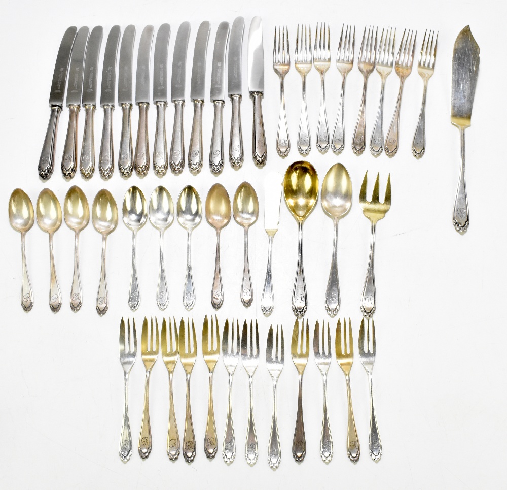 A German 800 grade thirty-two piece part canteen of cutlery each with cast floral detail, the