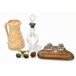 An early 20th century oak desk stand, with detachable inkwells, a Victorian glass decanter with