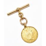 A George III 1787 gold guinea, with spade back and later yellow metal rope twist border and 18ct