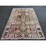 A Middle Eastern Sarouk-type hand woven wool carpet with panelled decoration, 311 x 207cm.