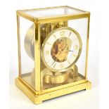JAEGER-LECOULTRE; a gilt brass Atmos clock with Arabic numeral and baton chapter ring, the top plate