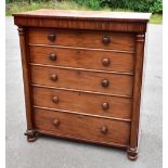 An early Victorian Scottish mahogany chest of five long graduated drawers flanked by turned