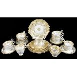 Two part tea/dinner services, with gilt floral detail on a celedon ground (29).Additional