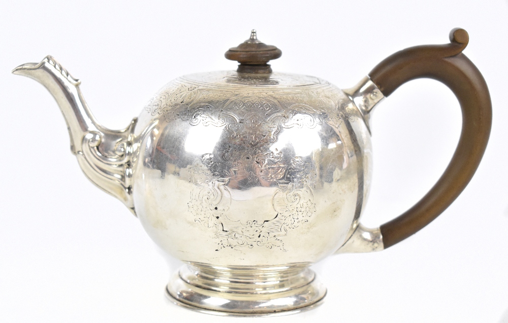 LAMBERT & CO; a Victorian hallmarked silver bullet teapot of George I/II design with bright cut