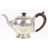 LAMBERT & CO; a Victorian hallmarked silver bullet teapot of George I/II design with bright cut